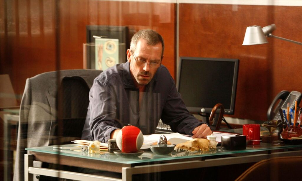 House Chrome and Glass Top Writing Desk used by Gregory House as seen in House