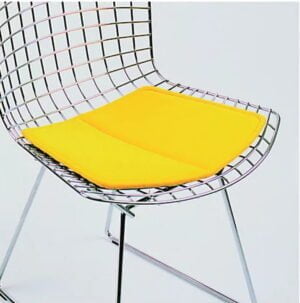 bertoia chairs with yellow pillow