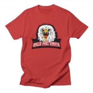 product-eagle-fang-karate-t-shirt-held-by-johnny-lawrence-william-zabka-in-cobra-kai-tv-show-season-3-episode-2