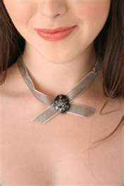Alice's choker necklace with Cullen crest