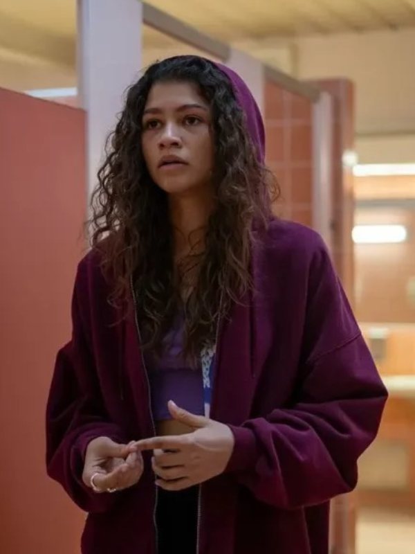 Rue wears her fathers maroon zip-up hoodie throughout the show as a kind of comfort blanket after he died. Euphoria, HBO.