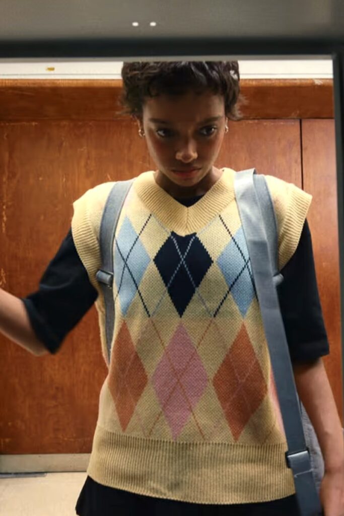 Mia’s Yellow Argyle Knitted Vest, in Everything Now. Netflix.