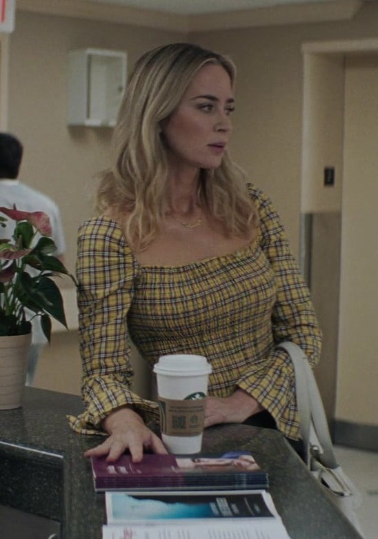 Yellow and black checkered blouse with square neckline and long sleeves by Emily Blunt as Liza Drake in Pain Hustlers (2023) movie