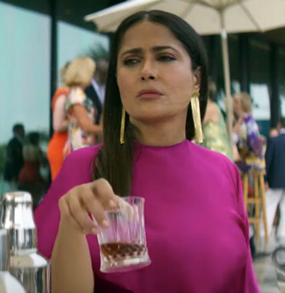 Max Mendoza’s Vibrant Pink Cape Jumpsuit in Magic Mike’s Last Dance