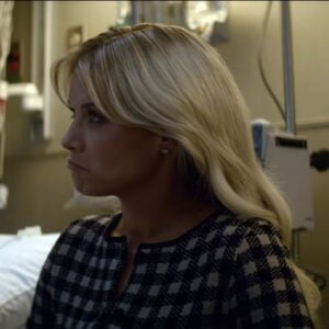 White & Black hecked cardigan worn by Ser­e­na Cro­ker (Sarah Jones) as seen in A Man in Full