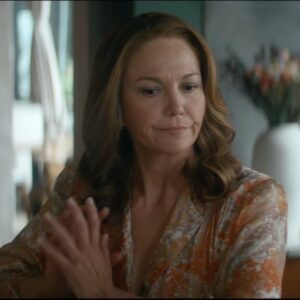 Vince Wrap Flo­ral-Print Blouse In Brown worn by Martha Cro­ker (Di­ane Lane) as seen in A Man in Full