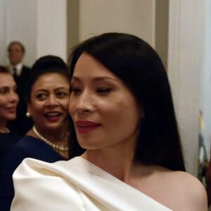 white one shoulder top and wide pants combo worn by Joyce Newman (Lucy Liu) as seen in A Man in Full