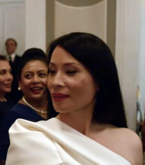 white one shoulder top and wide pants combo worn by Joyce Newman (Lucy Liu) as seen in A Man in Full